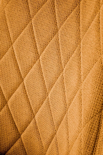 Čalouněná jídelní židle Fenri hořčicová moderní prošívaná s černými nohami Intesi