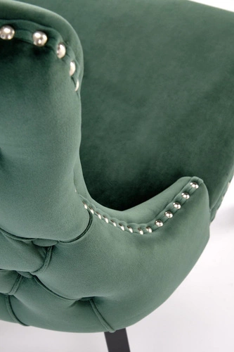 Čalouněná jídelní židle Iridionne Velvet tmavě zelená, sametová, na dřevěných nohách