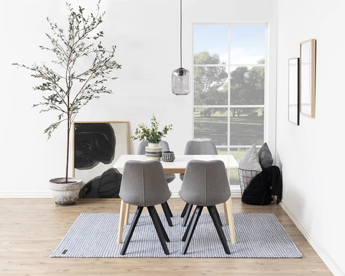 Jídelní židle Dima Actona šedá čalouněná skandinávský styl s černými dřevěnými nohami