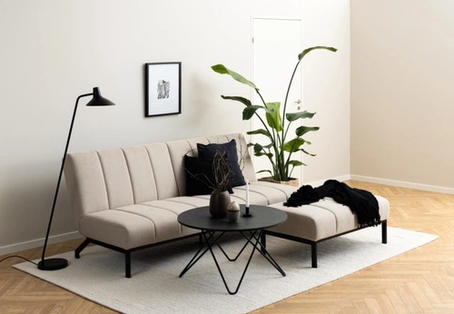 Čalouněný taburet Caix béžový Actona do obýváku a ložnice, moderní obdélníkový na černých nohách